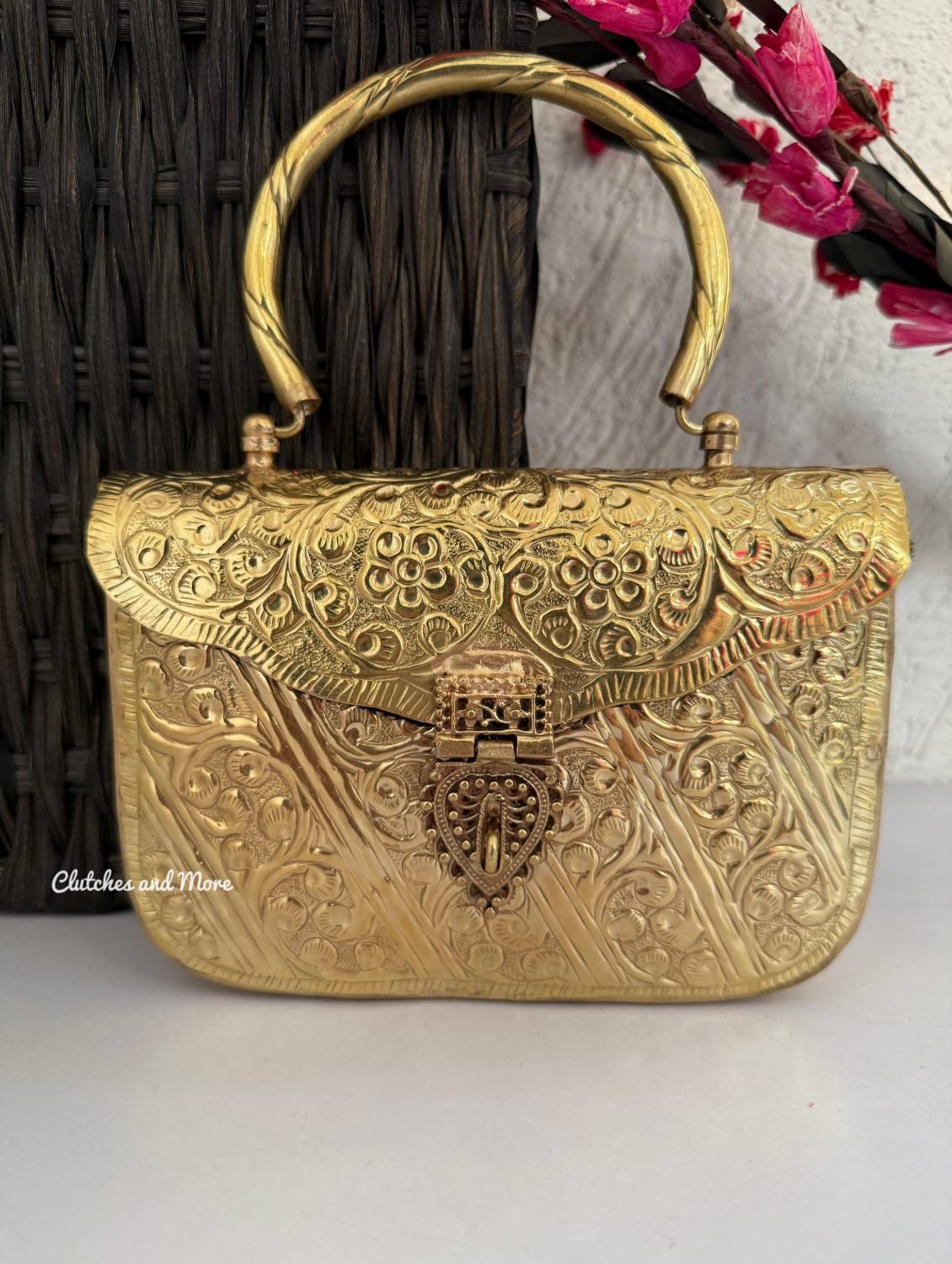 Anika Gold brass clutch with handle