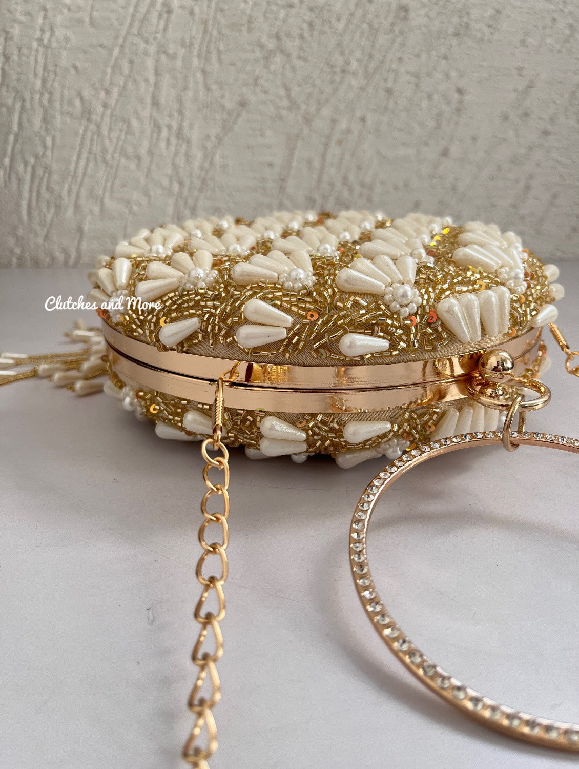 Praneeta Pearl Droplets Clutch Gold