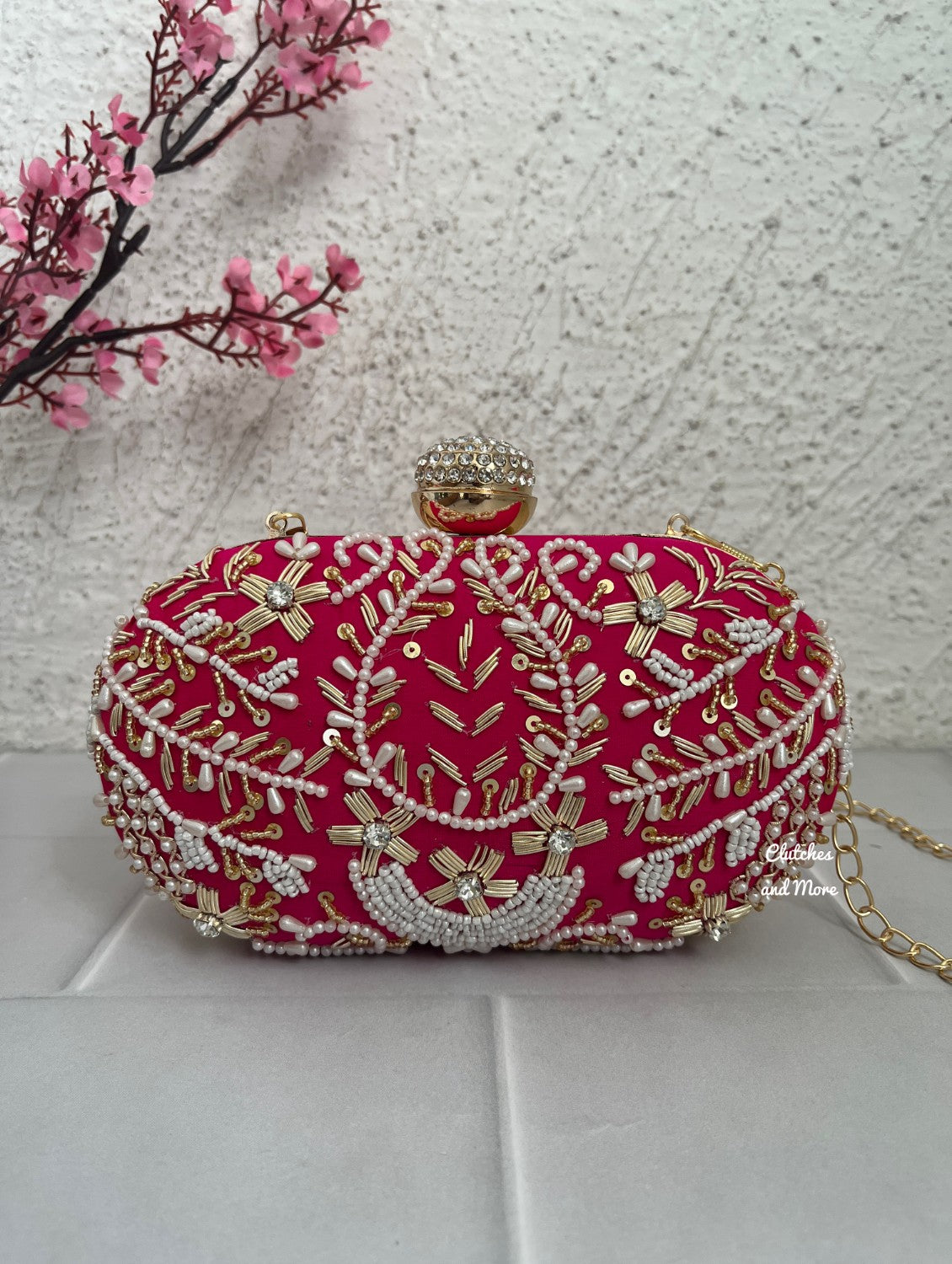 Aarohi Pink Capsule clutch