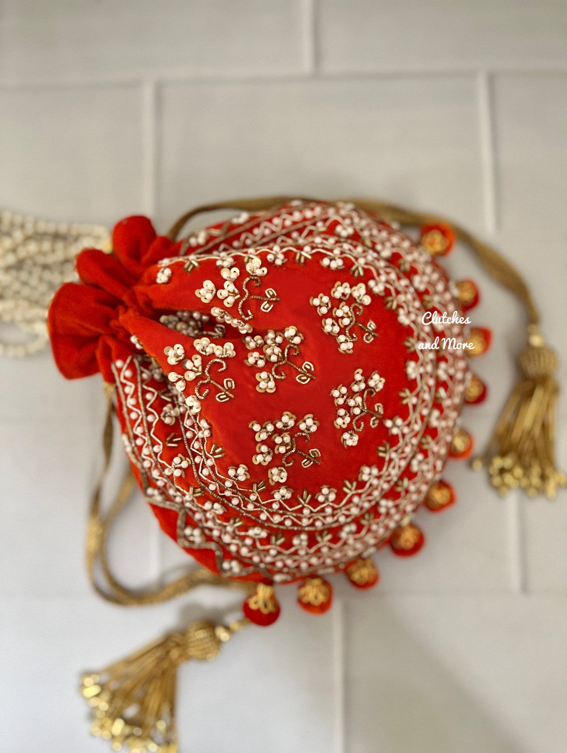 Orange Ball Tassles Potli