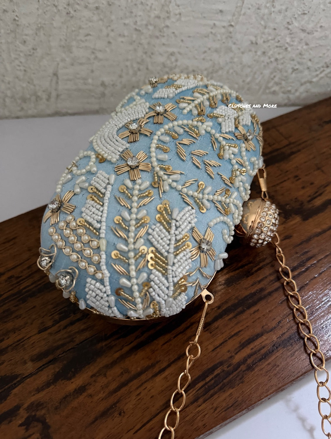 Aarohi Light Blue Capsule Clutch