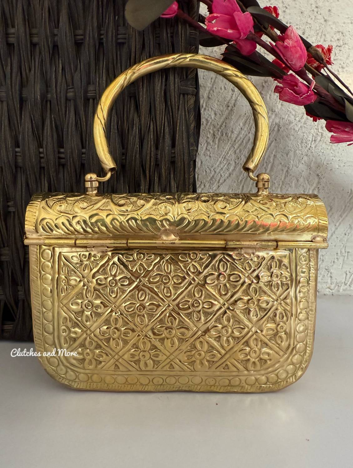 Anika Gold brass clutch with handle