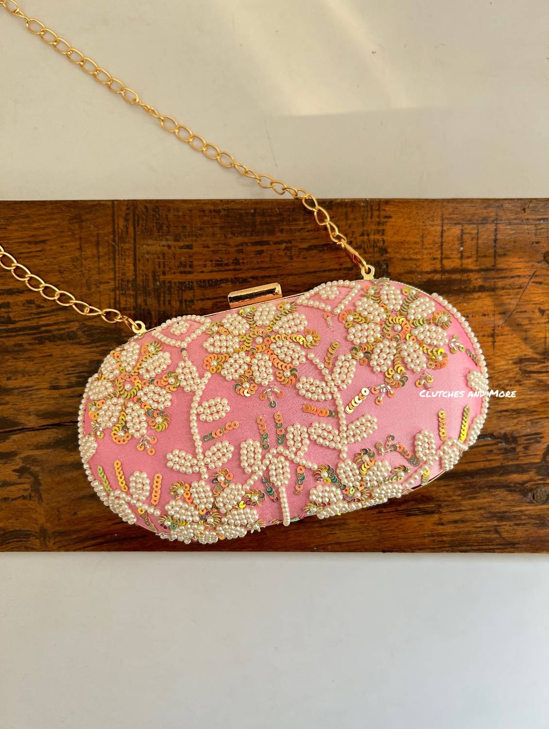 Alya pink capsule Clutch