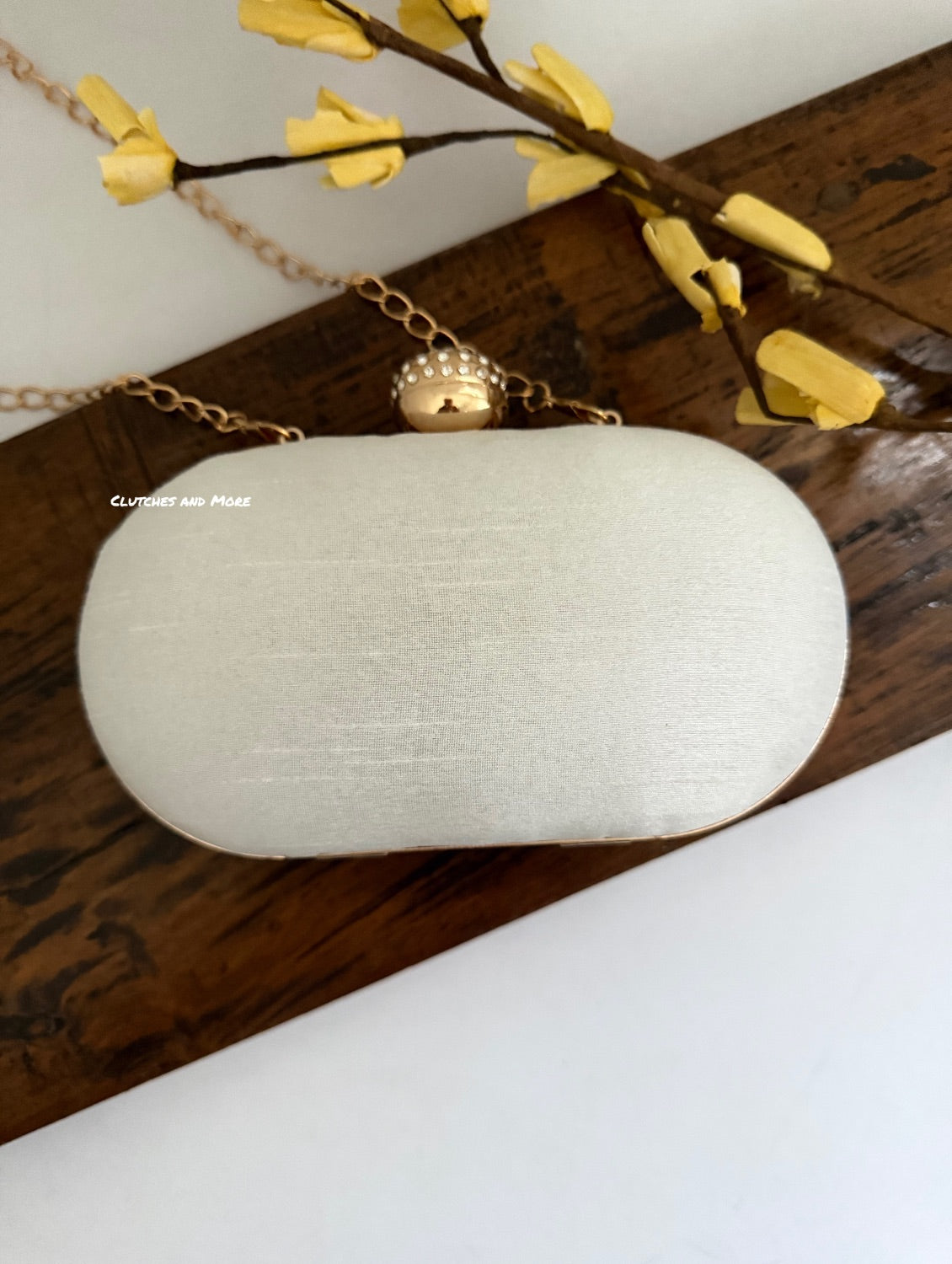 Aarohi Pastel White Capsule Clutch