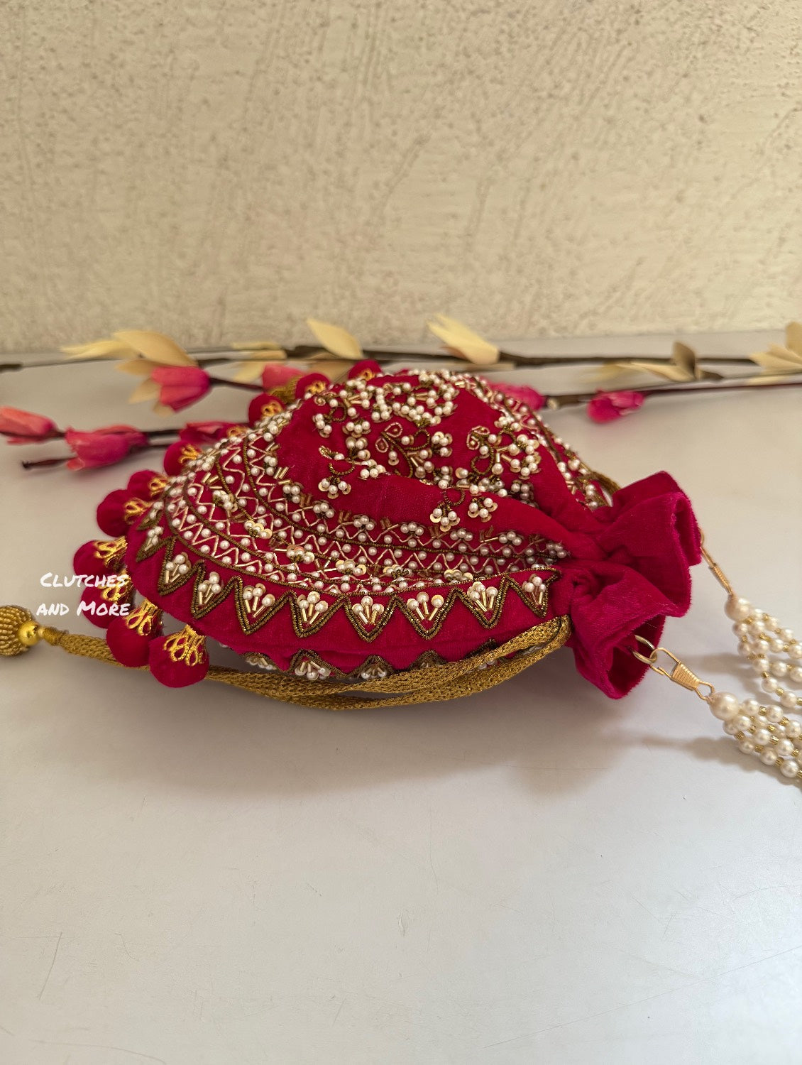 Rani Pink Ball Tassles Potli