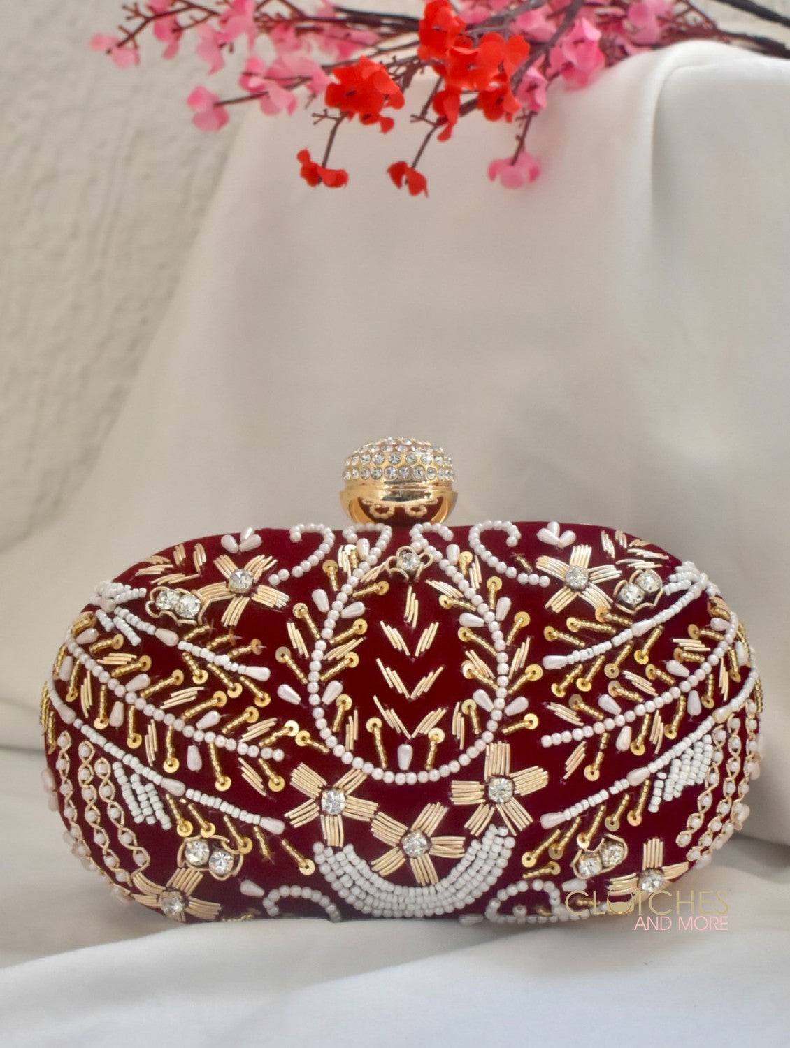 Aarohi Maroon Captivating Capsule Clutch