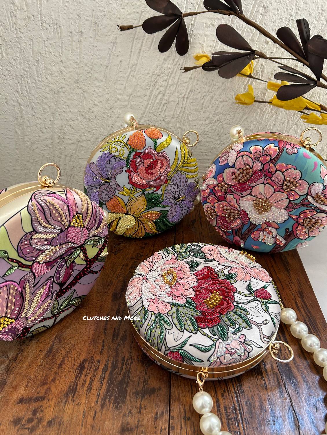 Poppy Floral Round Multicolored Clutch ( White Base )