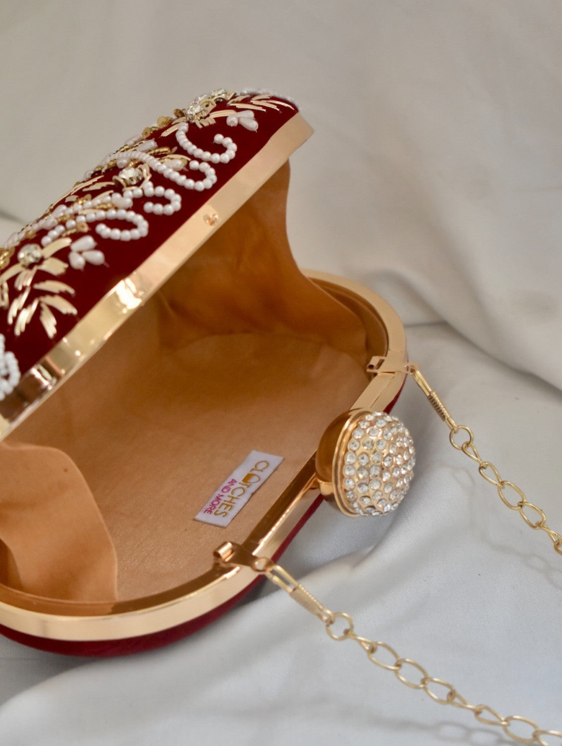 Aarohi Maroon Captivating Capsule Clutch