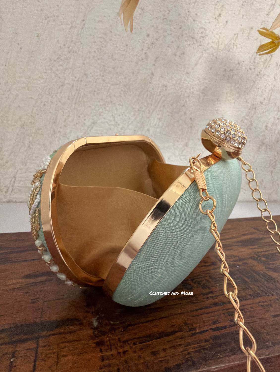 Aarohi Pastel Green Capsule Clutch