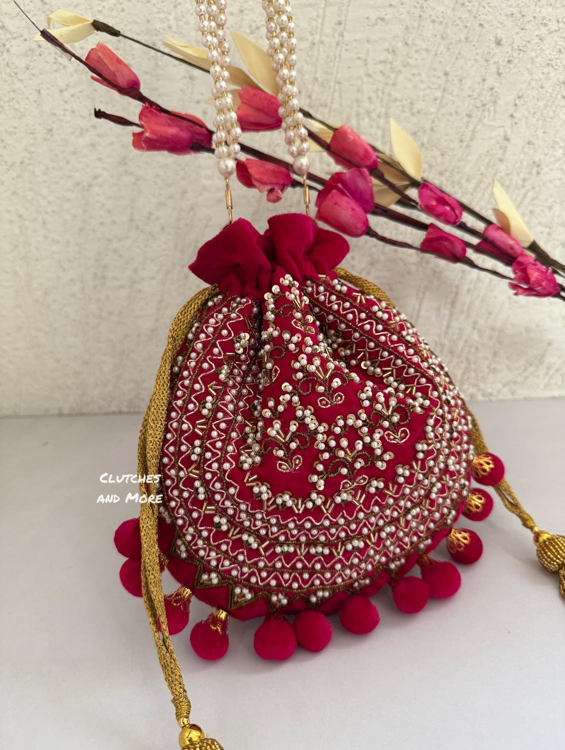 Rani Pink Ball Tassles Potli