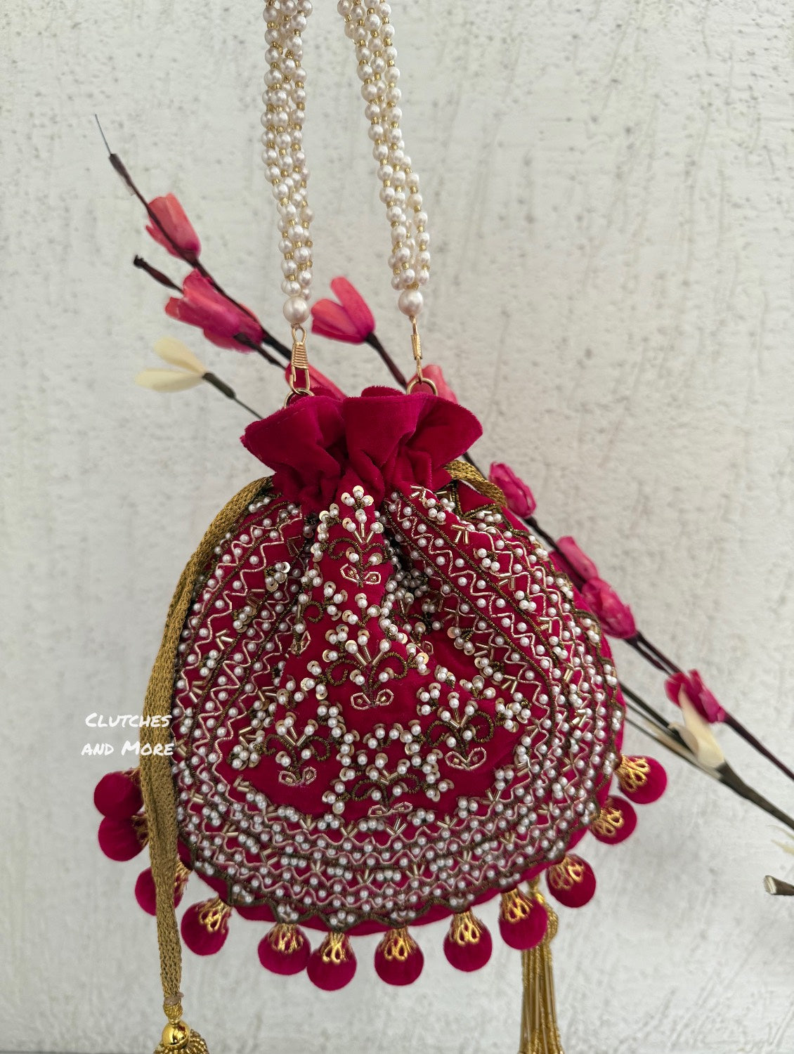 Rani Pink Ball Tassles Potli