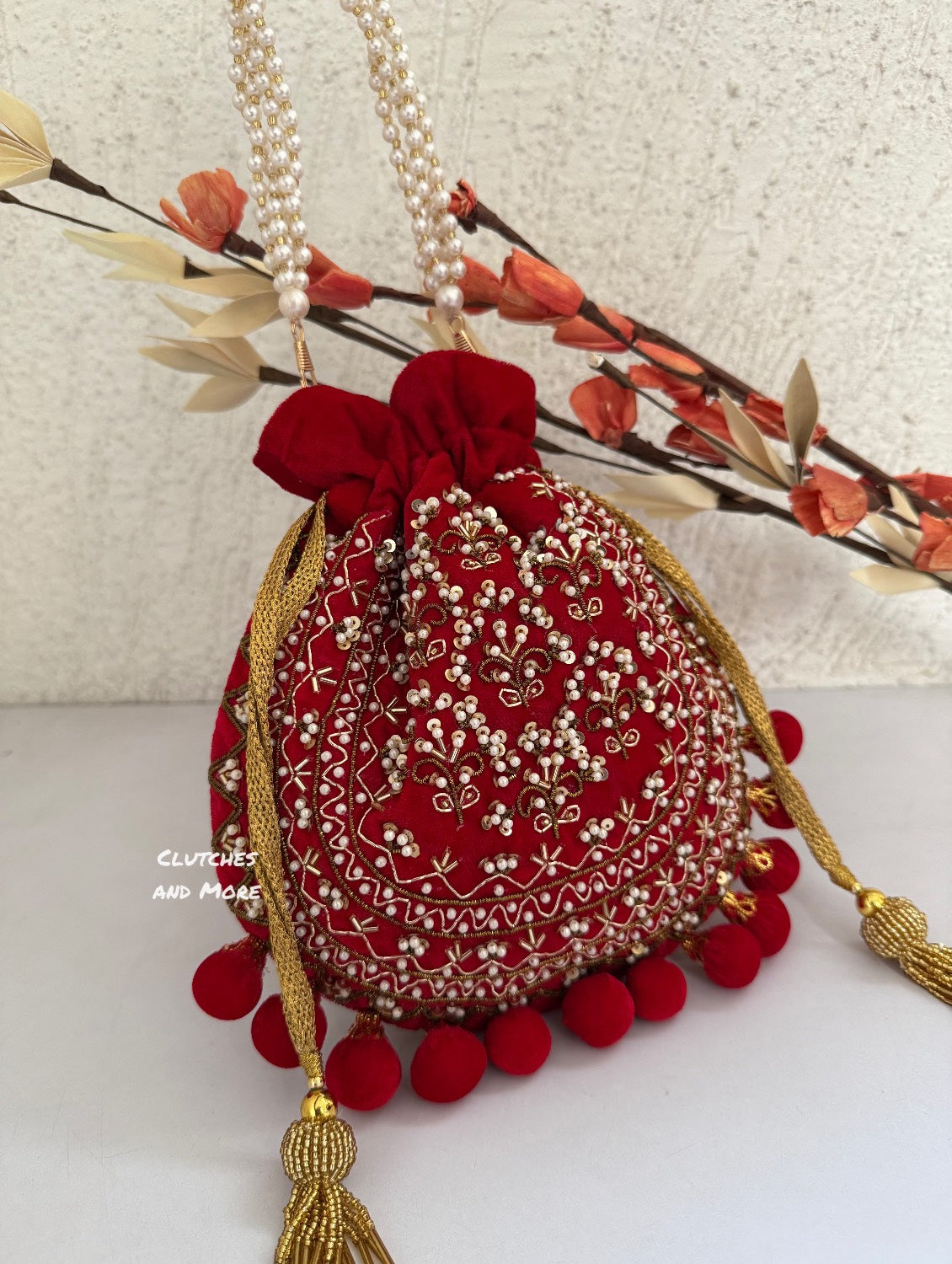 Red Ball Tassles Potli