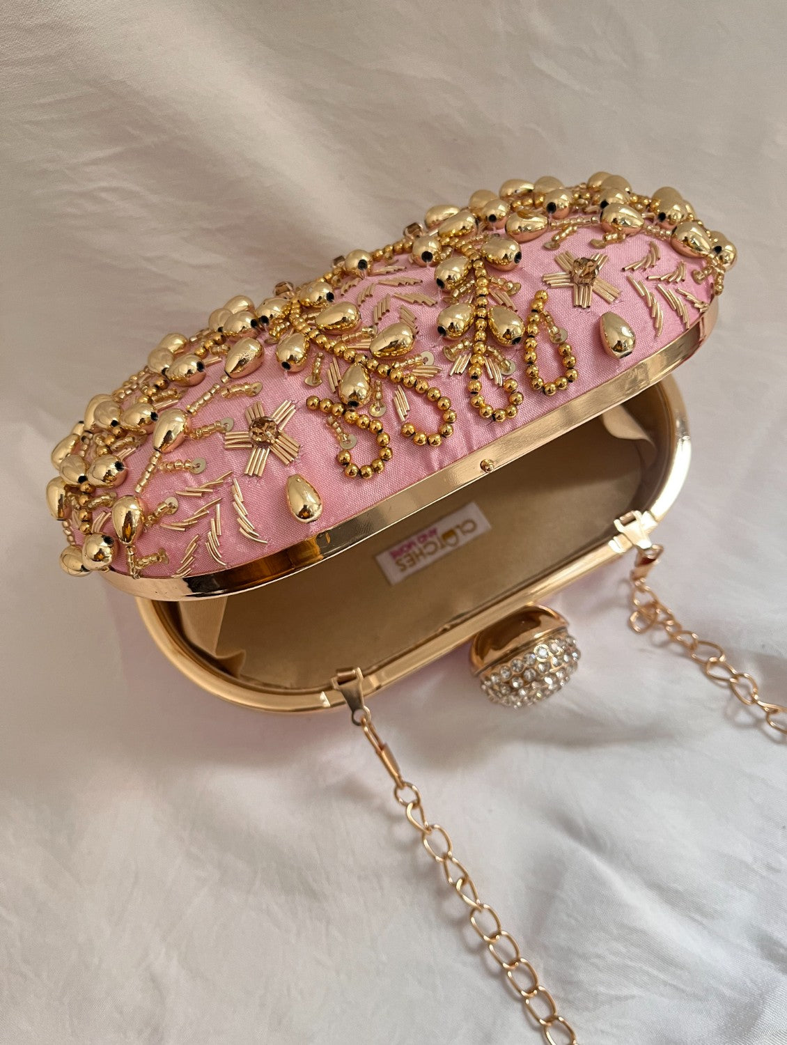 Pink and Gold Capsule clutch