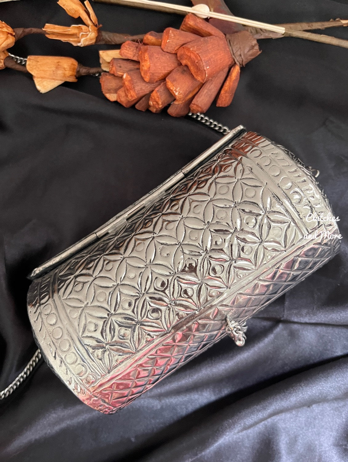 Cylindrical brass silver clutch