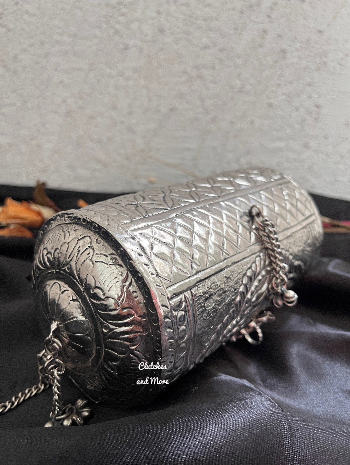 Cylindrical brass silver clutch