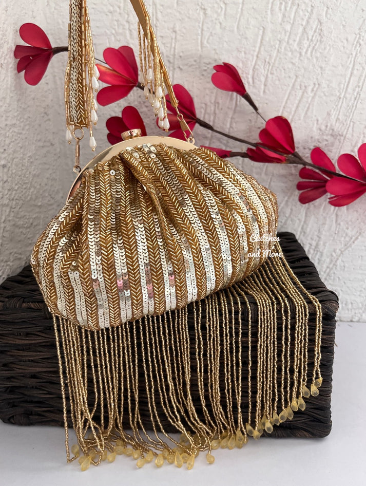 Golden celebrity inspired batua clutch bag