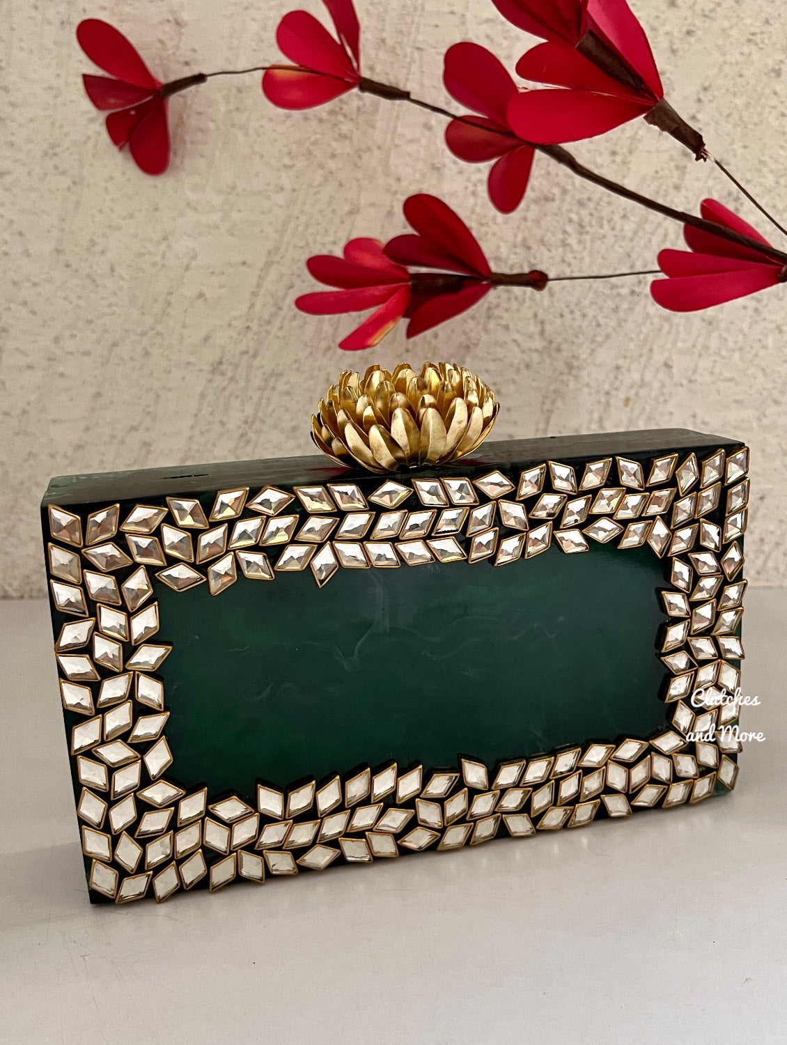 Kundan Green Resin clutch with Pearl Handle