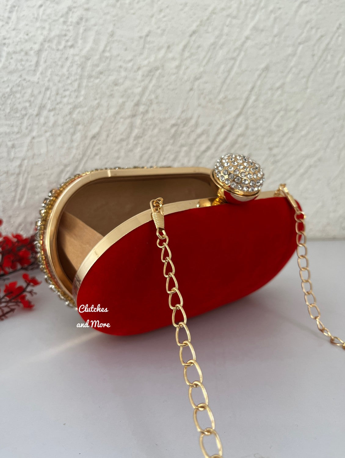 Red Capsule Diamond clutch