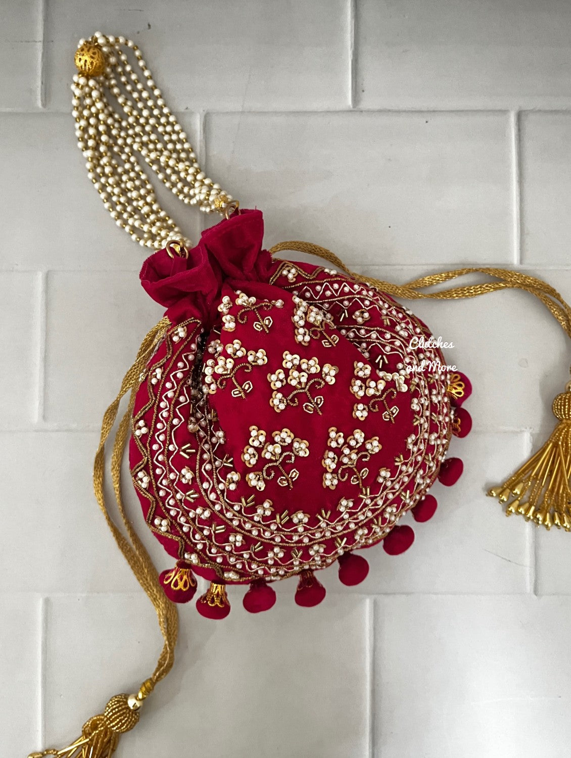 Rani Pink Ball Tassles Potli