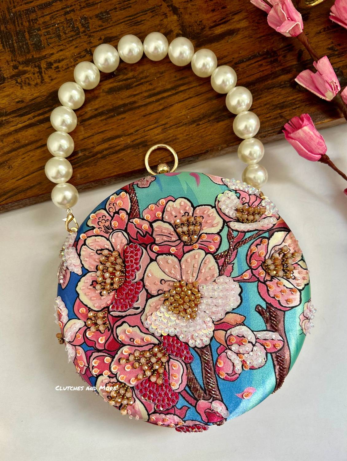 Poppy Floral Round Multicolored Clutch ( Blue base)