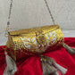 Vamika Cylindrical Gold Silver Brass Clutch with Tassles