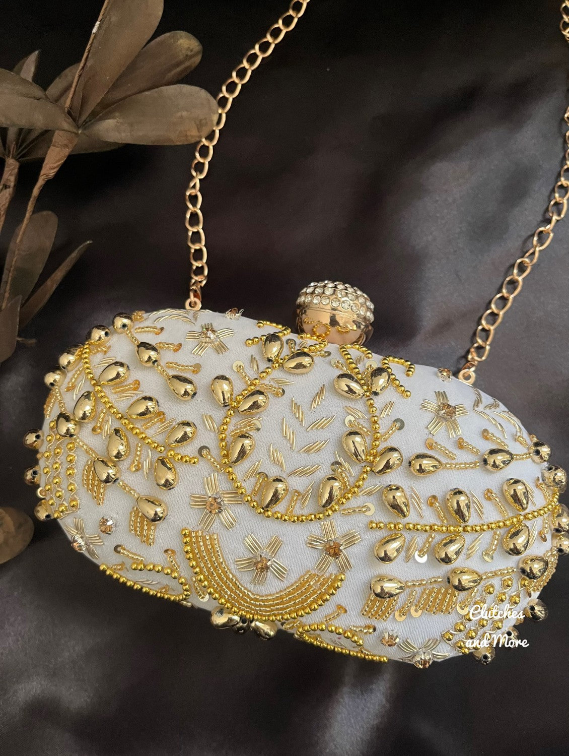 White and Gold Capsule clutch