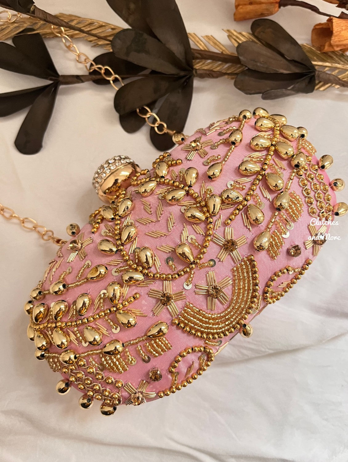 Pink and Gold Capsule clutch