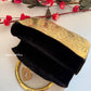 Anika Gold brass clutch with handle