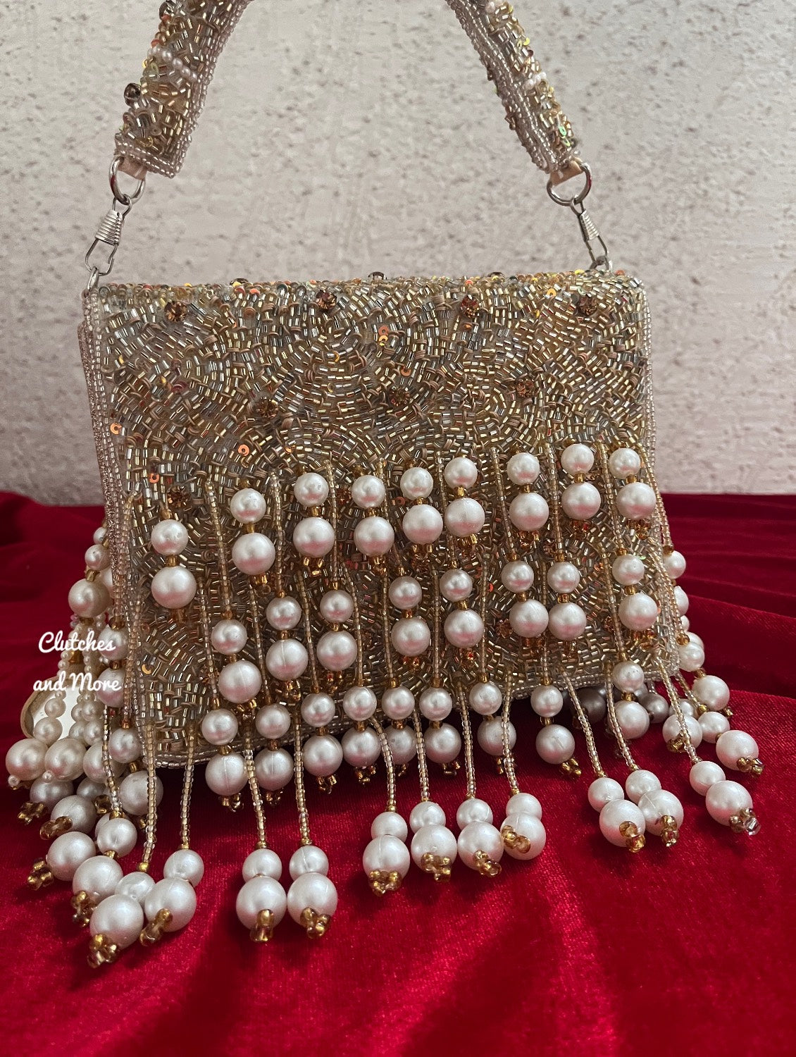 Jodha Pearl Tassle Clutch Gold