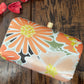 Orange and white Floral clutch