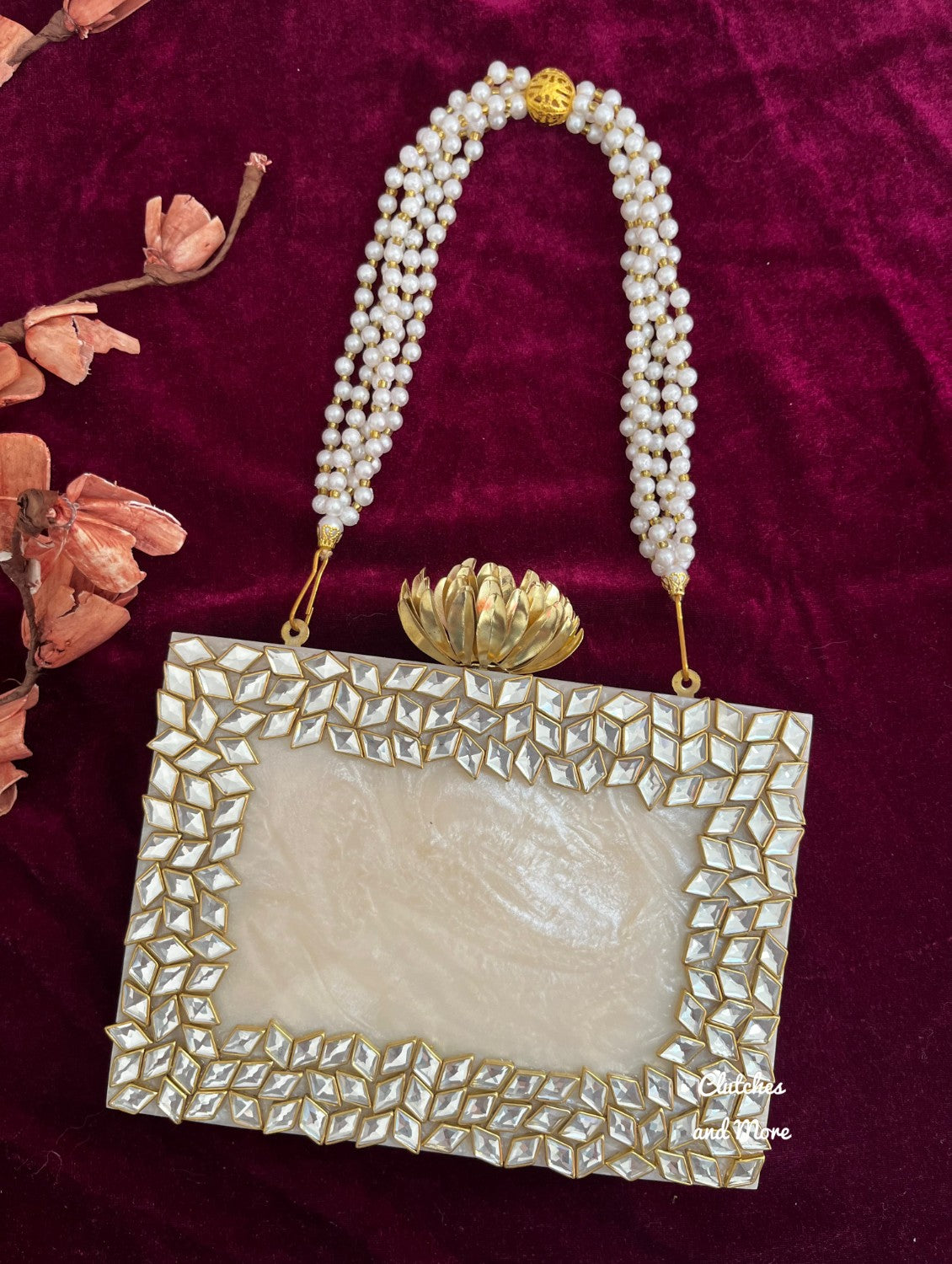 Kundan Resin clutch with Pearl Handle