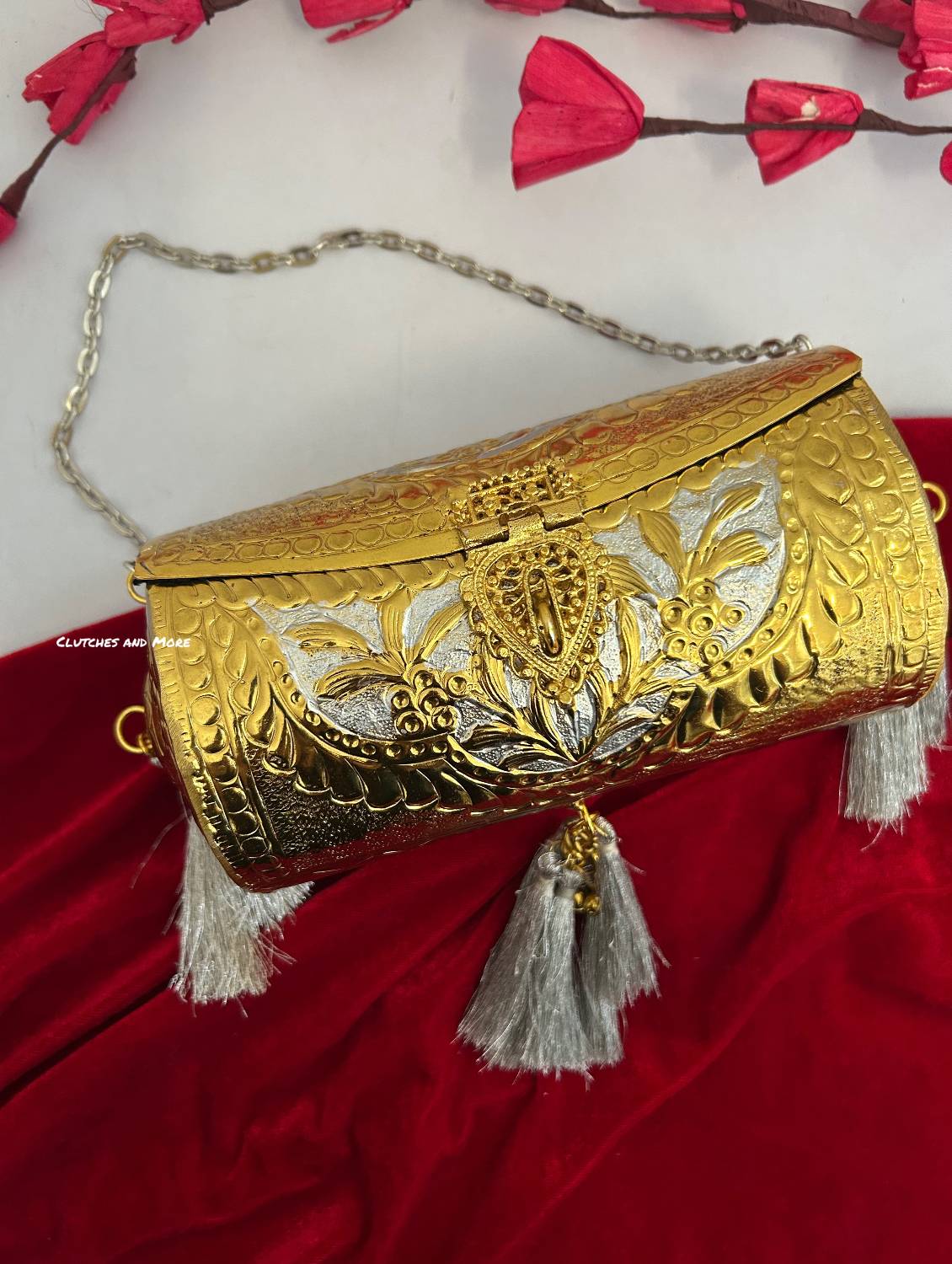 Vamika Cylindrical Gold Silver Brass Clutch with Tassles
