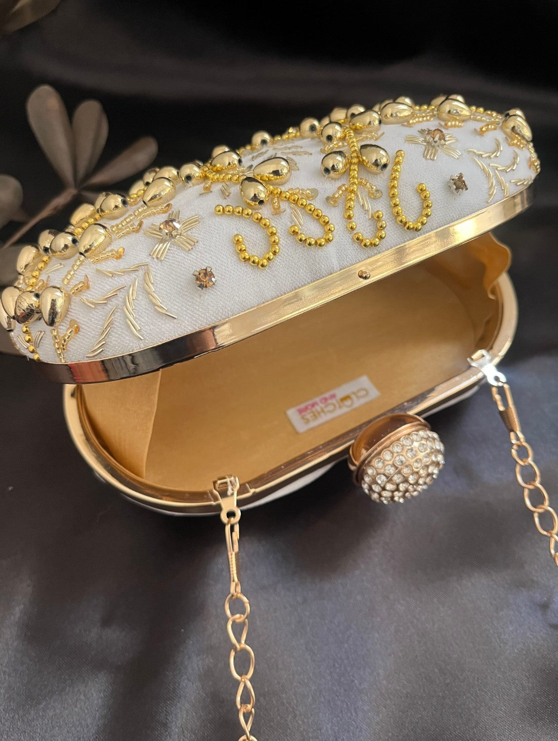 White and Gold Capsule clutch