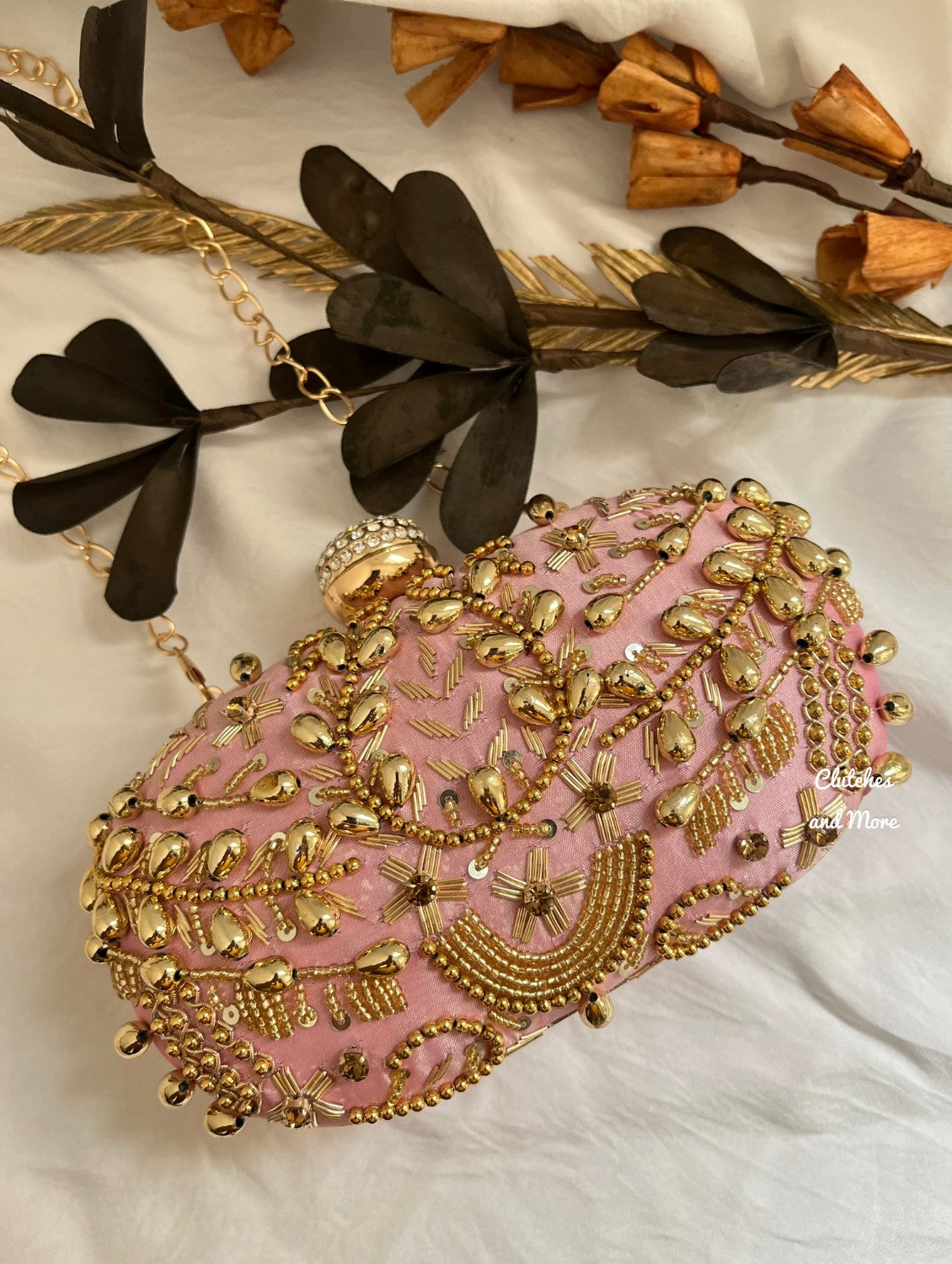 Pink and Gold Capsule clutch