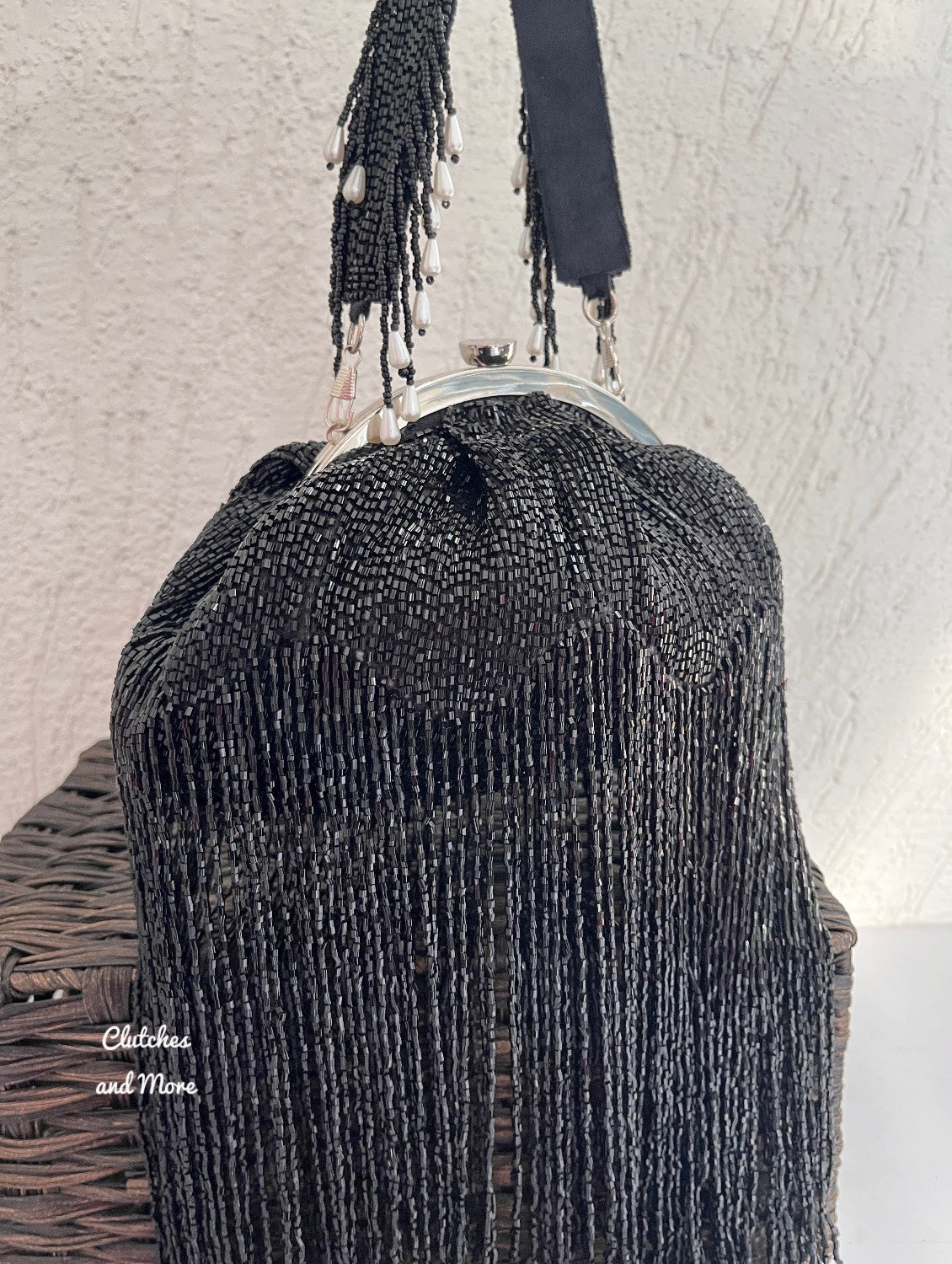 Black Batua Bag with long Tassles