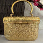 Anika Gold brass clutch with handle