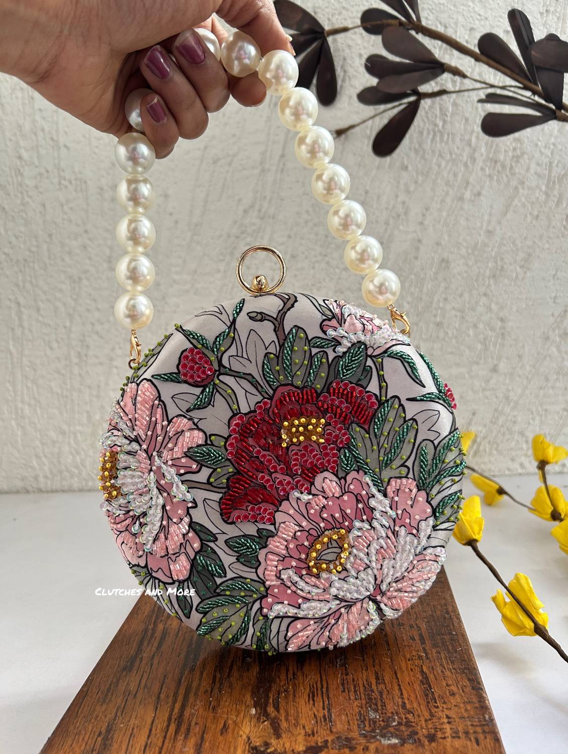 Poppy Floral Round Multicolored Clutch ( White Base )