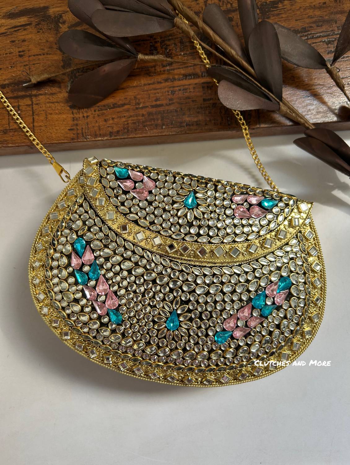 Kasika Kundan Brass Clutch with Pink Blue