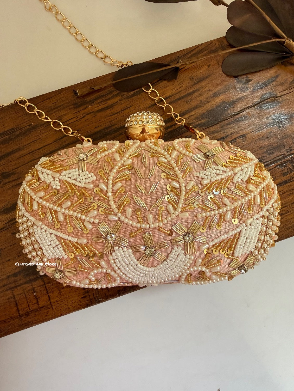 Aarohi Peach Capsule Clutch