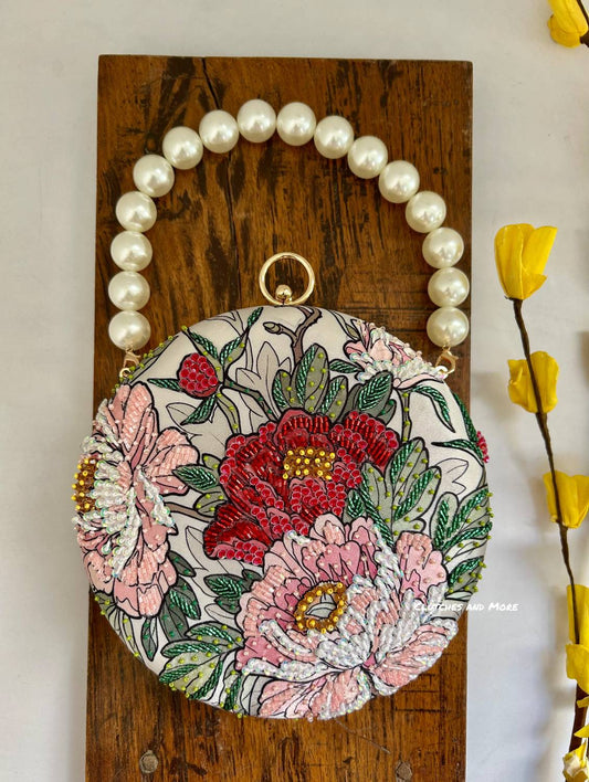Poppy Floral Round Multicolored Clutch ( White Base )