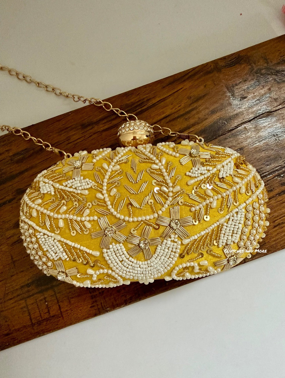 Aarohi Yellow Capsule clutch