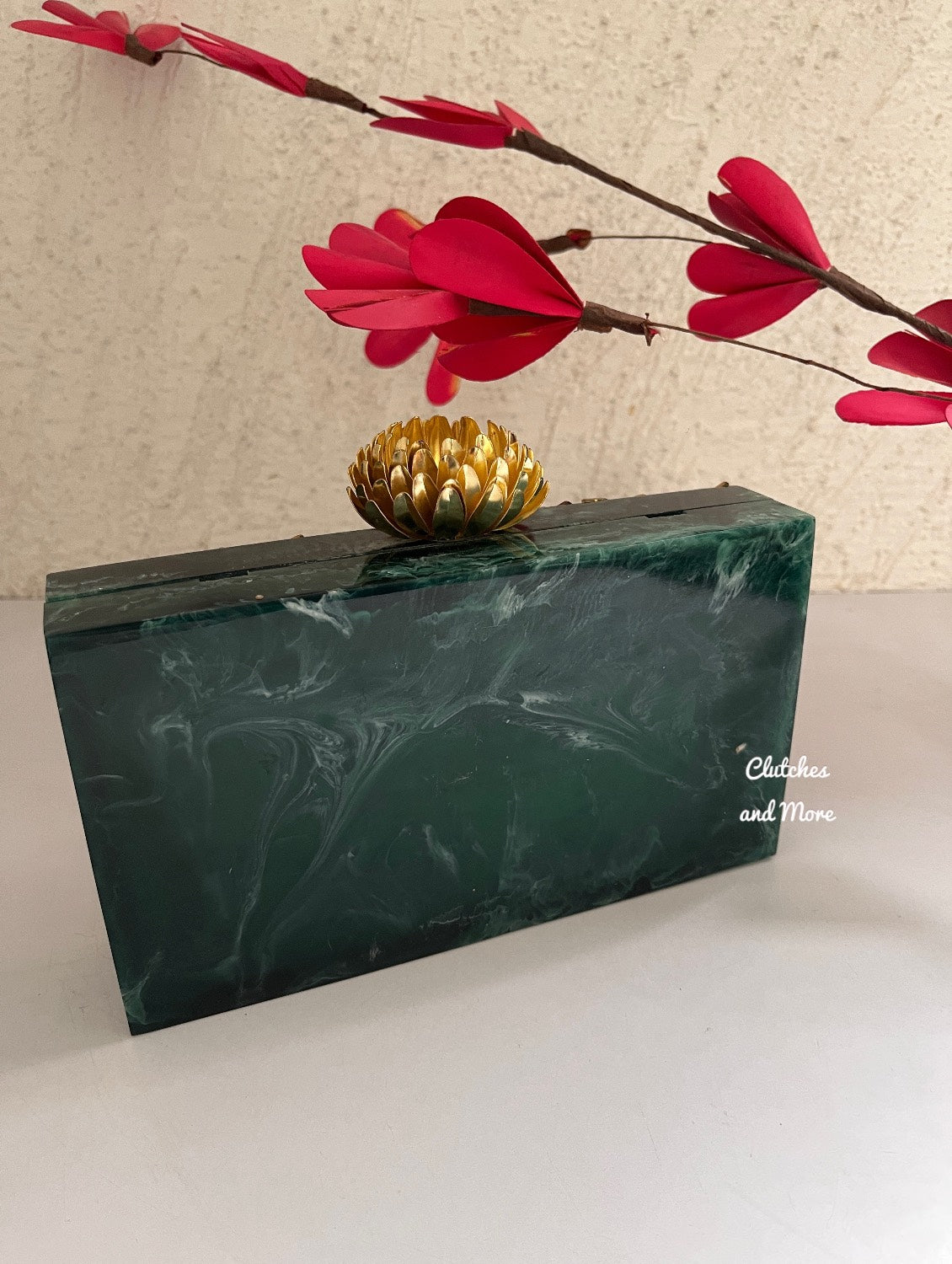 Kundan Green Resin clutch with Pearl Handle