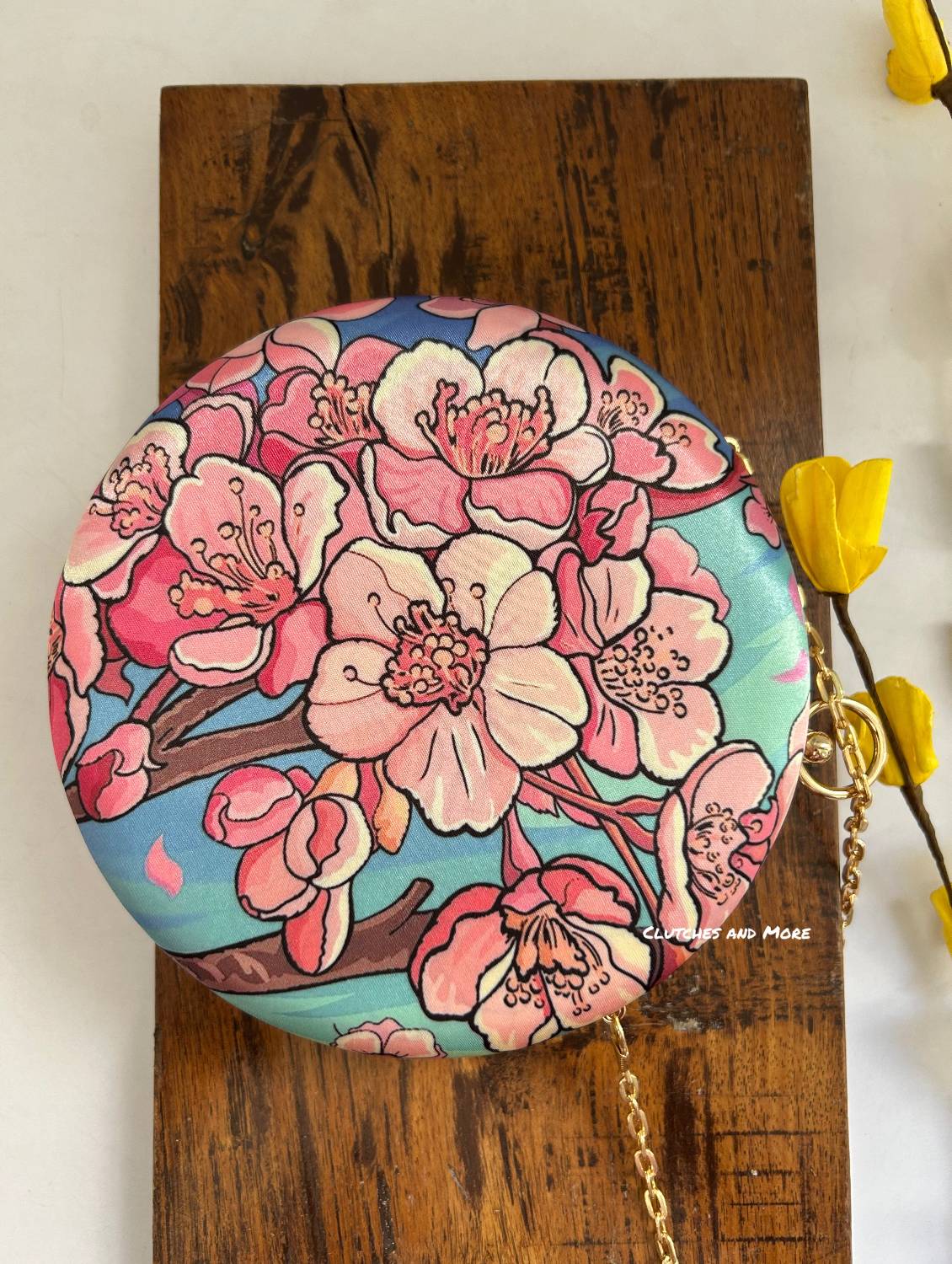 Poppy Floral Round Multicolored Clutch ( Blue base)