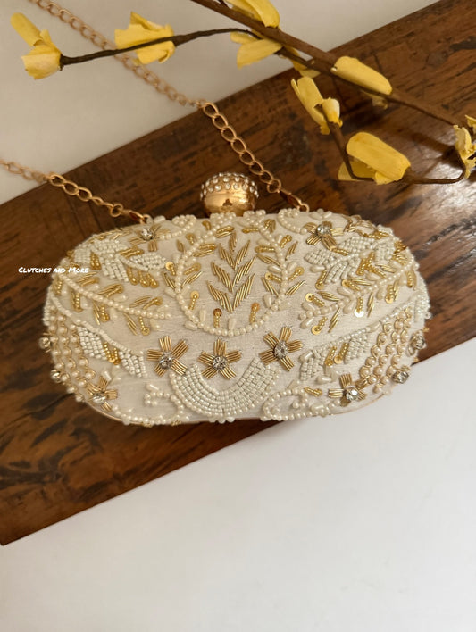 Aarohi Pastel White Capsule Clutch