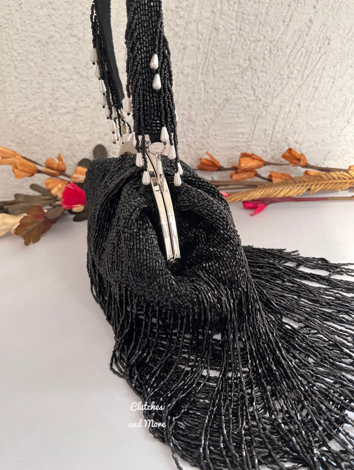 Black Batua Bag with long Tassles