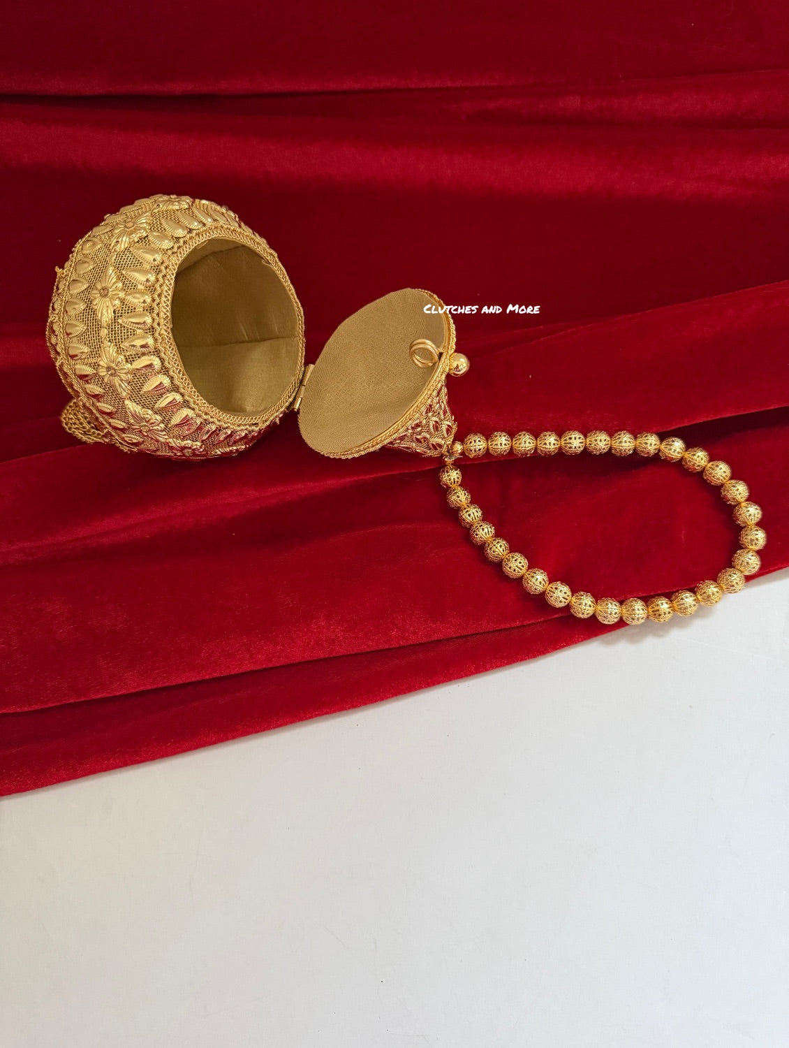 Mini Metal Potli Bag With Tassle ( Gold )
