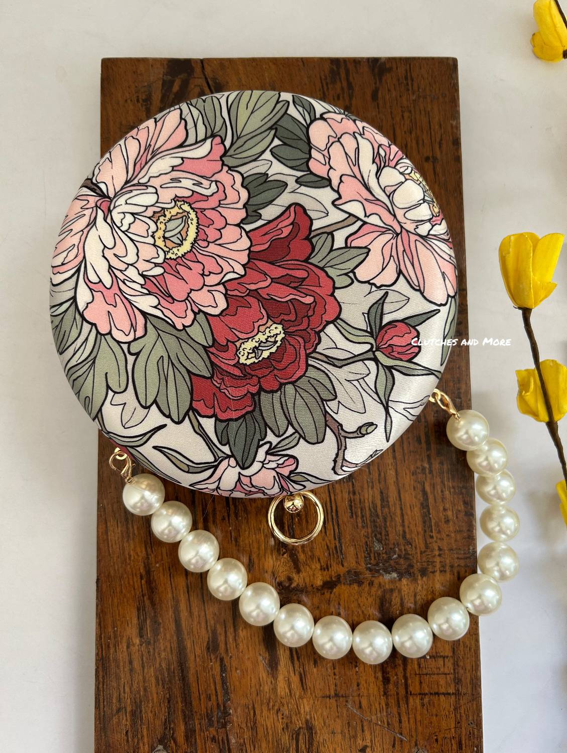 Poppy Floral Round Multicolored Clutch ( White Base )