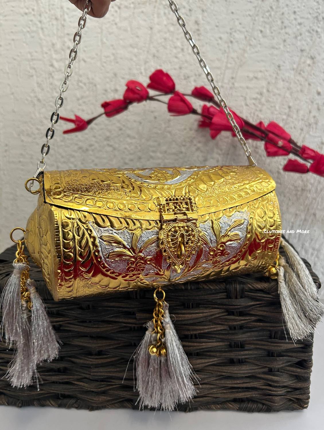 Vamika Cylindrical Gold Silver Brass Clutch with Tassles