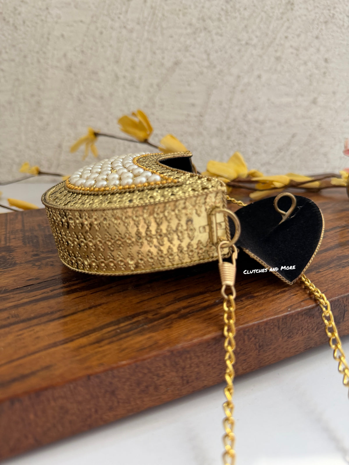 Kasika Kundan Pearl Brass Mini Clutch