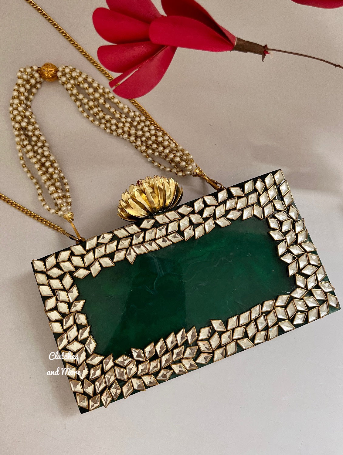 Kundan Green Resin clutch with Pearl Handle